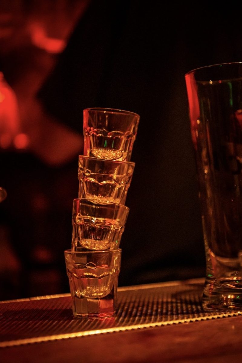 Stacked shot glasses on the bar counter