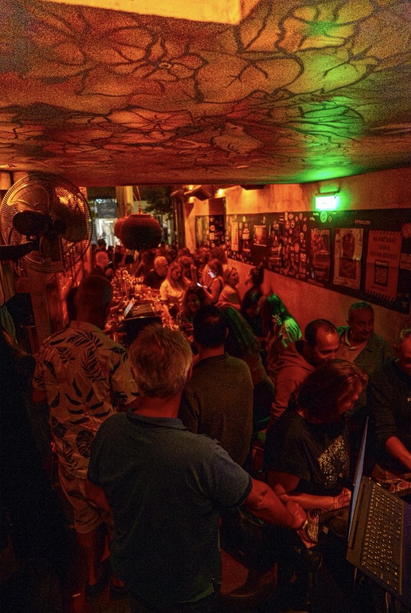 DJ night at The Dude Bar with crowd at the counter